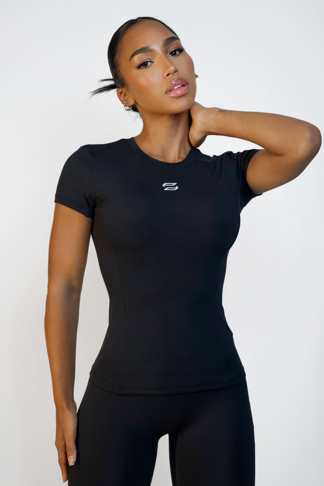Black short sleeve workout top for women with waist-length from Sanhouse Fit.